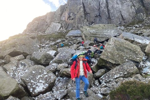 Students walking on boulders at Fair Head